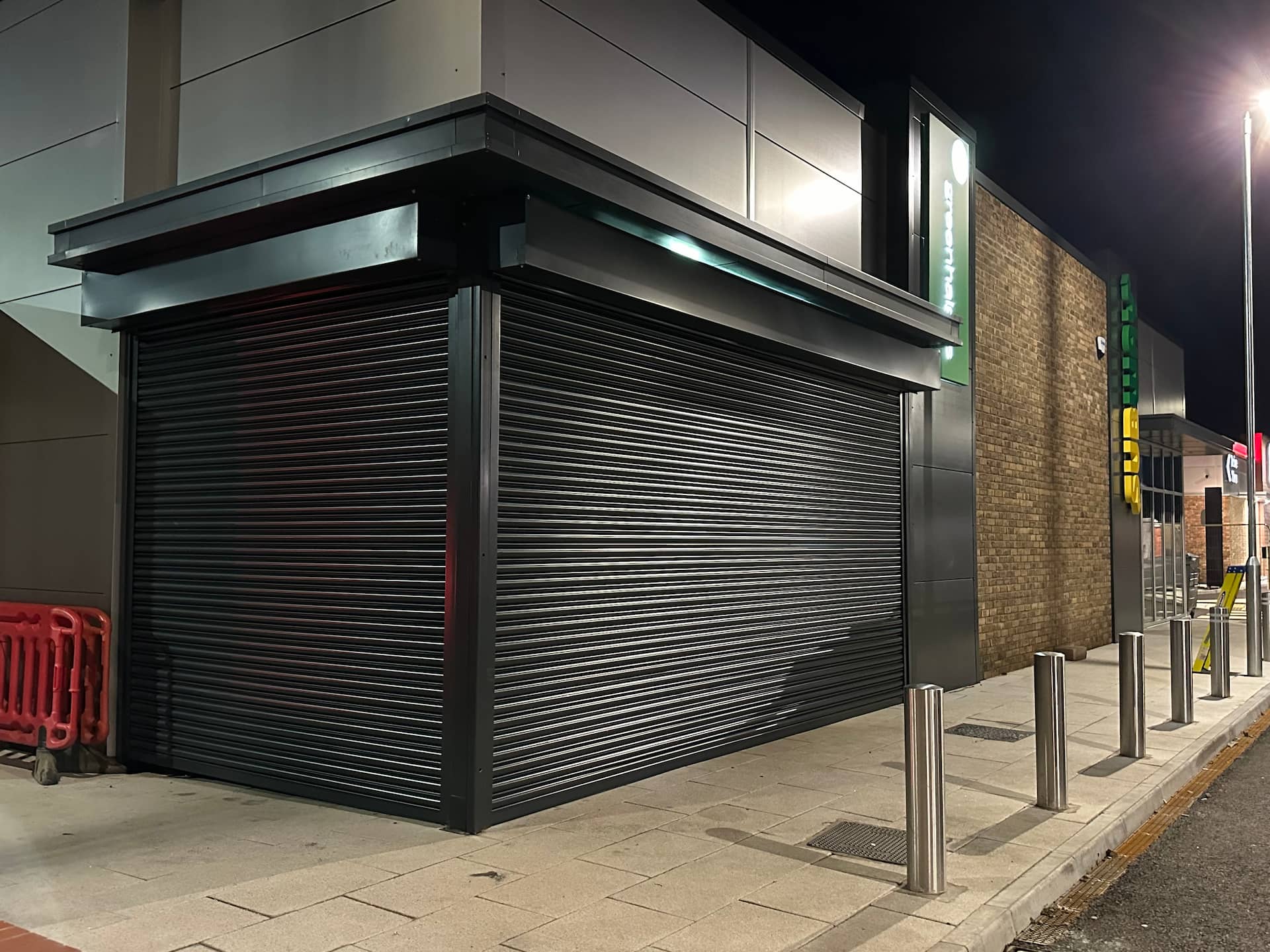 Large galvanised steel commercial roller shutter on an industrial unit